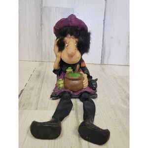 Halloween spooky Hollow sitting witch feet dangle potion frog